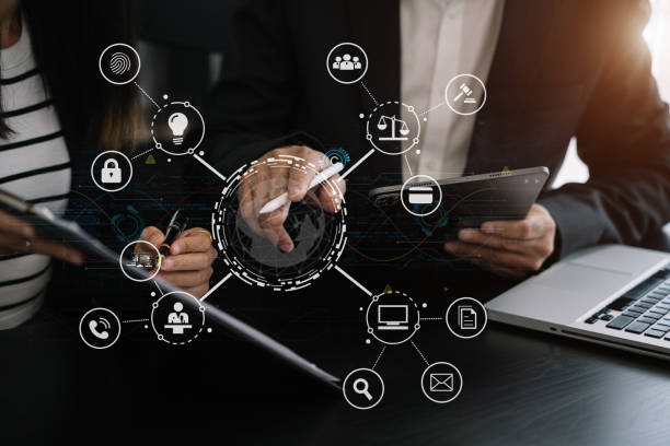 istock Copyright or patent concept, business team hand using laptop computer, tablet and smartphone with virtual screen copyright icon trademark, Creation ownership against piracy at office. 1530044885