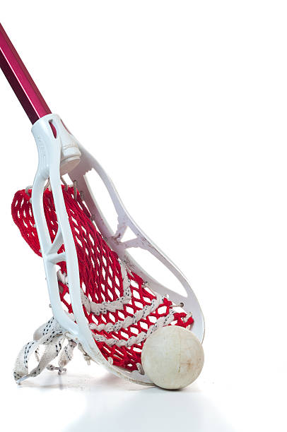 istock Lacrosse stick with ball leaning up on white background 153004768