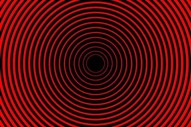 Vector illustration of Concentric red cirles on black background