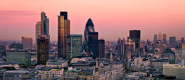 City of London at twilight City of London one of the leading centres of global finance. This view includes Tower 42 Gherkin,Willis Building, Stock Exchange Tower and Lloyd`s of London and Canary Wharf at the background. lloyds of london photos stock pictures, royalty-free photos & images
