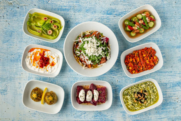 istock Different kinds of Turkish appetizers on white porcelain plates 1530061047