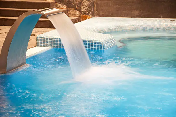 Photo of An amazing hot tub with a designed waterfall jet