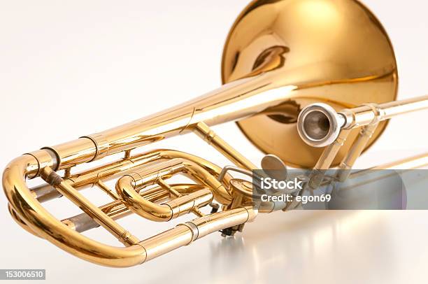 A Closeup Of The Back Of A Golden Trombone Stock Photo - Download Image Now - Trombone, Brass Band, Musical Instrument