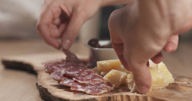 istock hands taking italian antipasti appetizers from table 1530072458