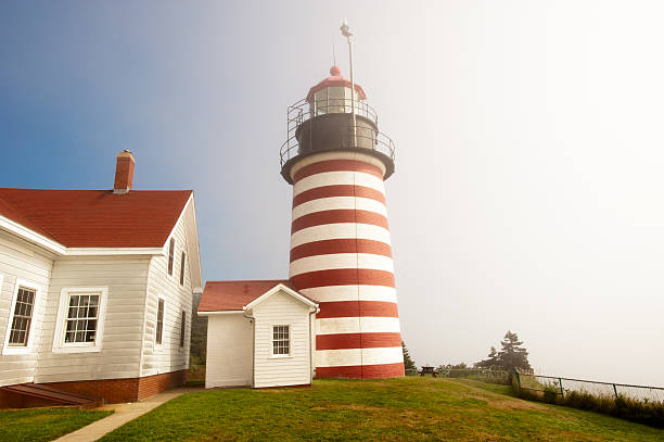 West Quoddy lighthouse West Quoddy lighthouse on northern Atlantic coastline of Maine quoddy head state park stock pictures, royalty-free photos & images