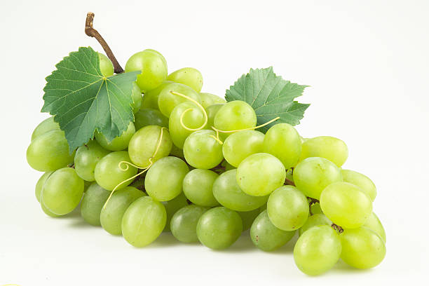 istock Fresh green grapes with leaves. Isolated on white 153009876