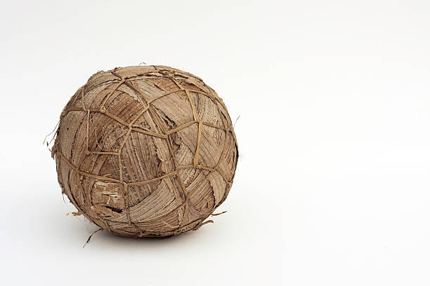 A handmade alternative to a leather football/soccer ball. Intricately made out of dried banana leaves tightly packed together and held in place by lengths of straw.