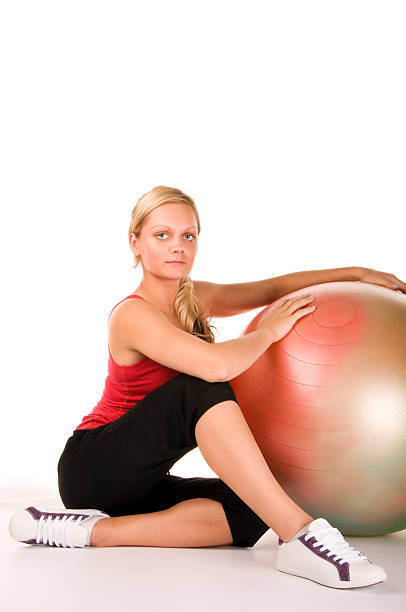 istock Blond girl exercising with a pilates ball 153011550