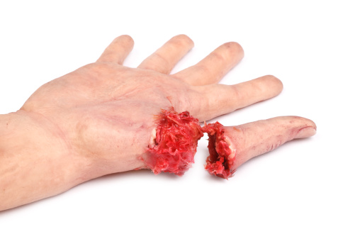 artificial human hand with cut out finger on white background,