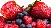 Summer collection of berries - strawberries, blueberries & raspb