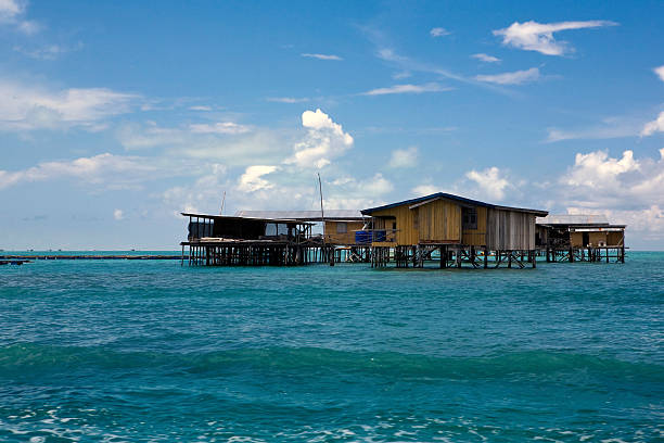 istock Houses on stilts in the sea 153013368