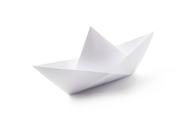 istock White boat made from folded paper on a white background 153013566