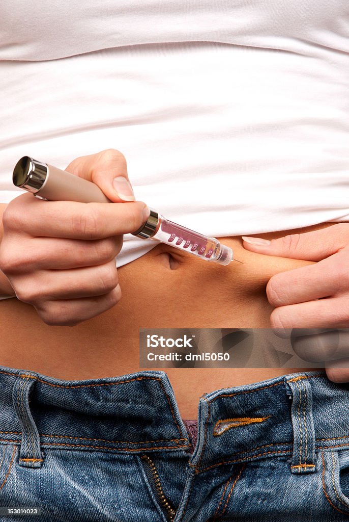 Diabetes insulin shot by syringe pen Diabetes insulin patient making insulin shot by injecting syringe pen small needle syringe with 3mll dose of humalog close-up composition Adult Stock Photo