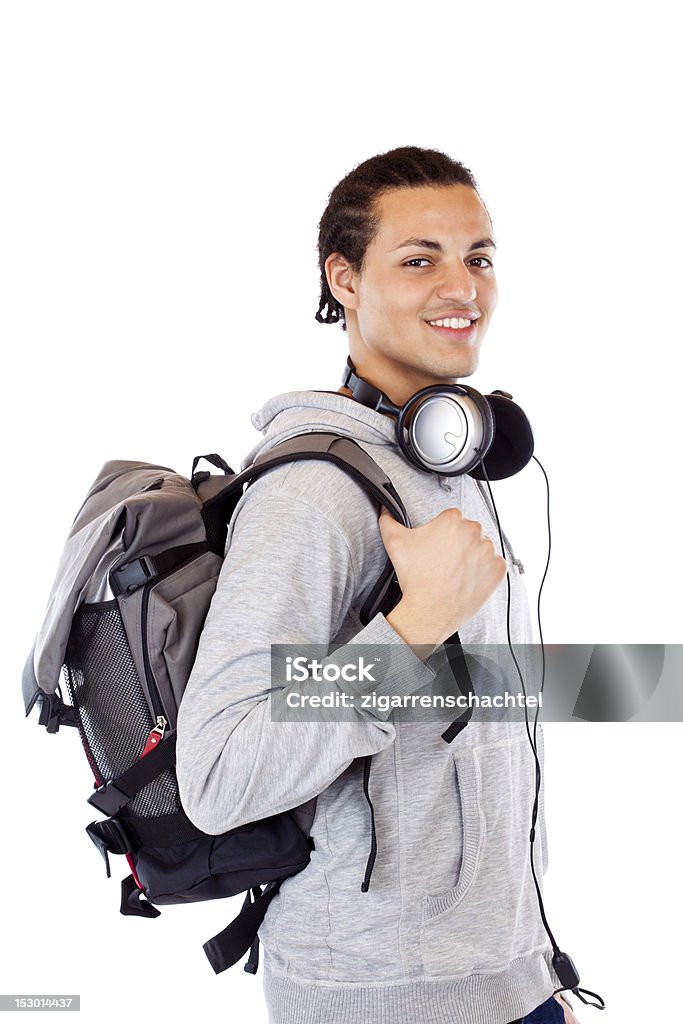 Junge amerikanische Studentin mit Rucksack und Kopfhörer lächelt happy - Lizenzfrei Auszubildender Stock-Foto