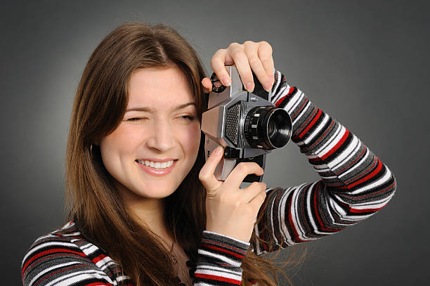 istock woman  with vintage camera 153015204