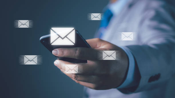 istock Businessman using smartphone with new email notification for business e-mail communication and digital marketing. Inbox receiving electronic message alert internet technology. 1530153640