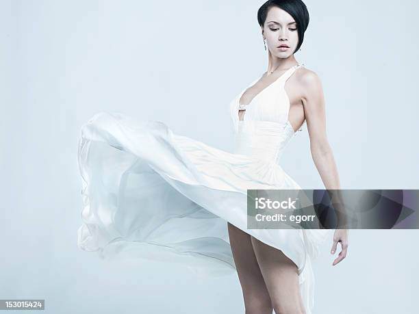 Beautiful Young Lady In A Billowing White Dress Stock Photo - Download Image Now - Dress, 20-24 Years, 20-29 Years