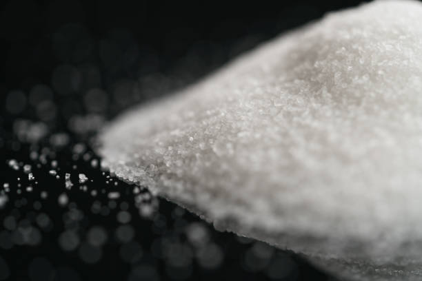 istock white sugar heap on black background closeup photo 1530155748