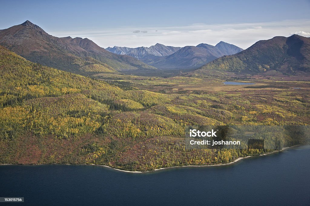 Alaskan Mountain Valley Alaskan mountain valley with hills meeting a blue lake. Gates of the Arctic National Park Stock Photo