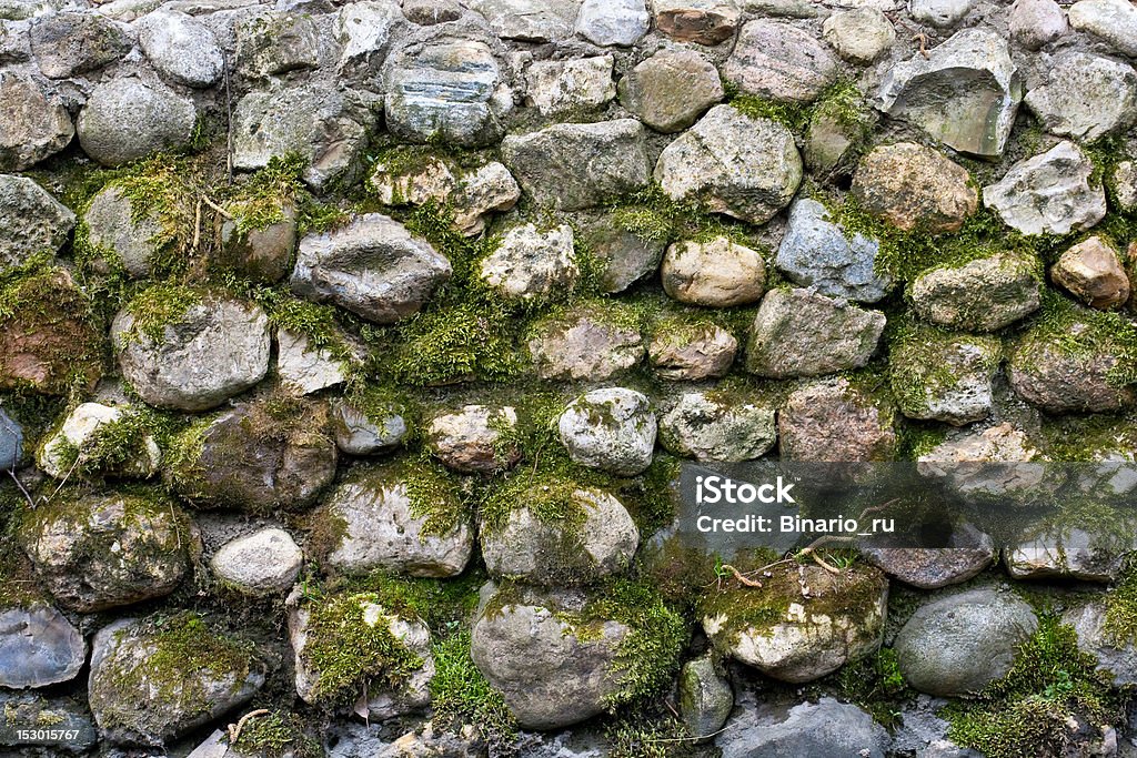 Old stone wall Stone wall with moss. Abstract Stock Photo