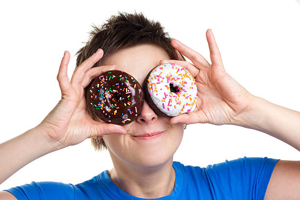 istock Smiling girl with donuts as eyes 153016726