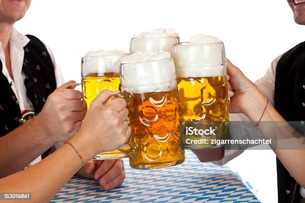 Bavarian Men And Women Toast With Beer Fest Beer Stein Stock Photo - Download Image Now