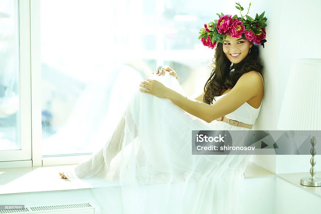 Greek goddess Beautiful woman in white dress posing before camera Adult Stock Photo