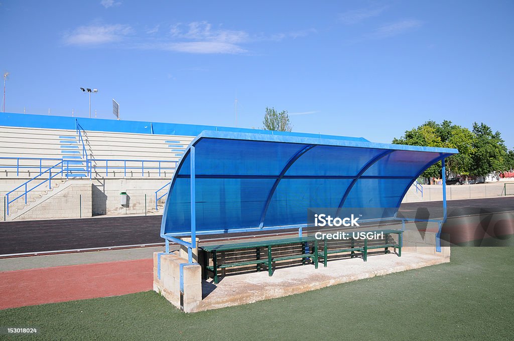 Outdoor Soccer Field Dugout Soccer field dugout with bleachers and track in background Bench Stock Photo