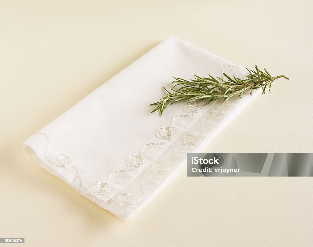 Napkin and Fresh Rosemary Sprig of fresh rosemary laying on top of a white napkin. Aromatherapy Stock Photo