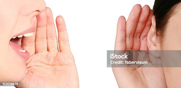 Close Up Of A Woman Whispering Gossip To Another Person Stock Photo - Download Image Now