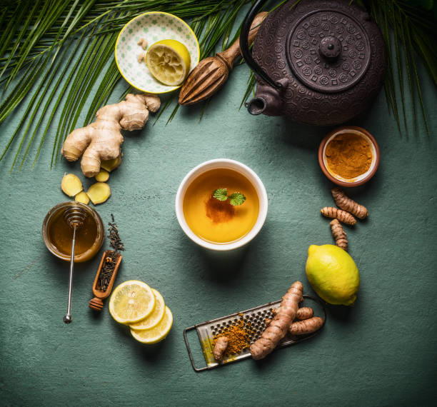 istock Cup of healthy herbal turmeric tea with ingredients 1530193436