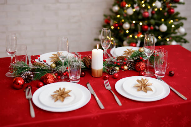 istock Served table for christmas dinner with plates, forks, knifes and glasses 1530199710