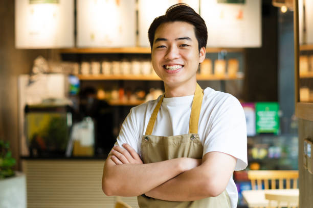 istock Asian man sitting at coffee shop 1530201576