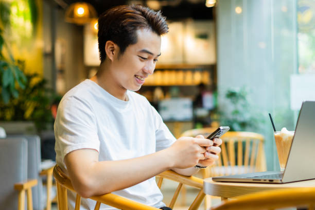 istock Asian man sitting at coffee shop 1530201717