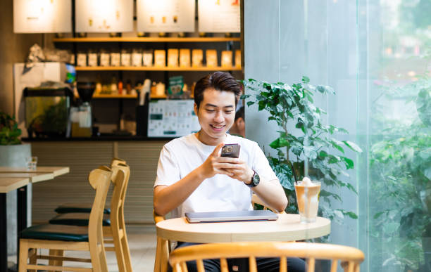 istock Asian man sitting at coffee shop 1530202374