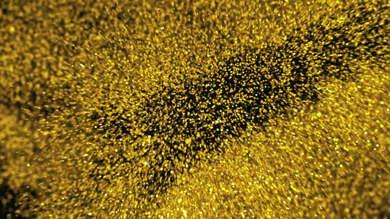 SLO MO LD Flying golden glitter and confetti