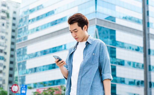 istock Asian man walking on the street 1530214368