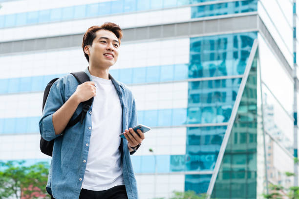 istock Asian man walking on the street 1530215016