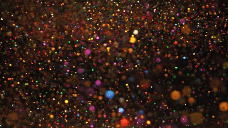 SLO MO LD Colourful glitter and confetti flying in the air