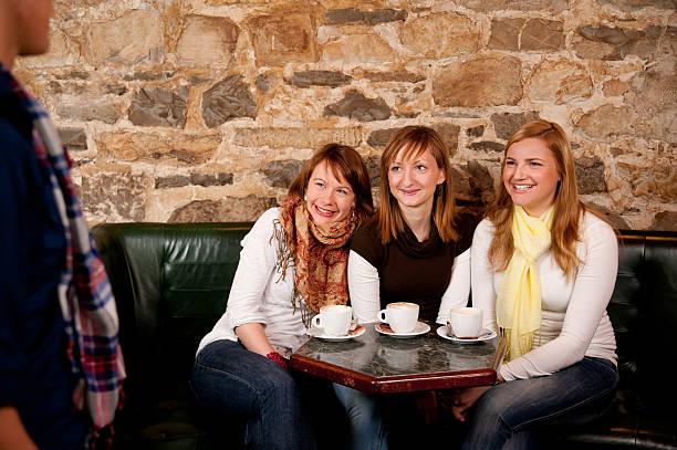 istock Man just arrived in caffee three girls were expecting him 153021614
