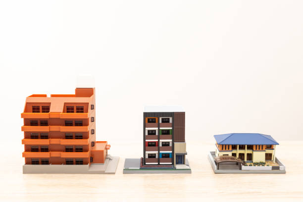 istock Model of a house placed on a desk 1530246447