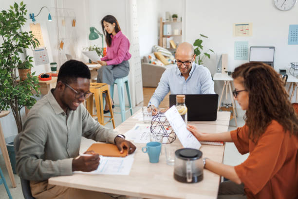 istock Young casually clothed colleagues working at modern office 1530248078
