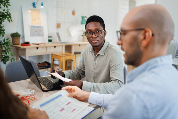 istock Two colleagues working at the office together 1530250320