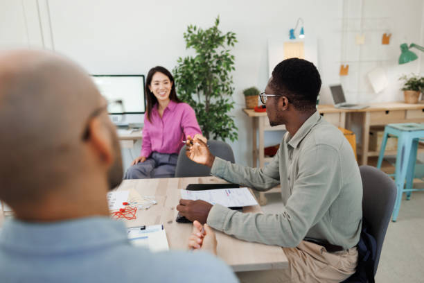 istock Colleagues having team meeting at the office 1530250353