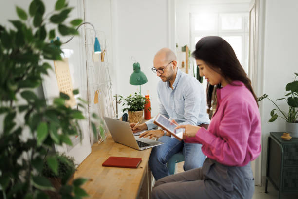 istock Two colleagues working together at modern office 1530253153