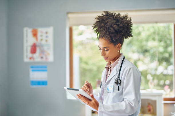 istock Female doctor working with digital tablet in clinic 1530254293