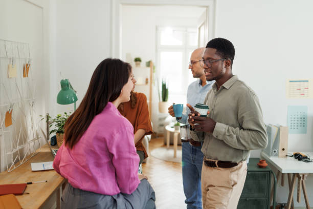 istock Colleagues talking together while having coffee break at the office 1530255408