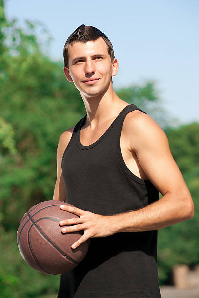 istock Young man with basketball 153027807