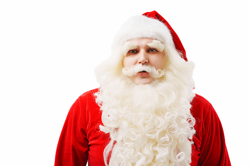 portrait of the surprised Santa Claus on a white background. The concept of Christmas and New Year sales. the tradition of buying and giving gifts.