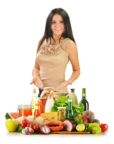 mujer joven con variedad de productos comestibles aislado en blanco - pickle cheese milk bottle olive fotografías e imágenes de stock